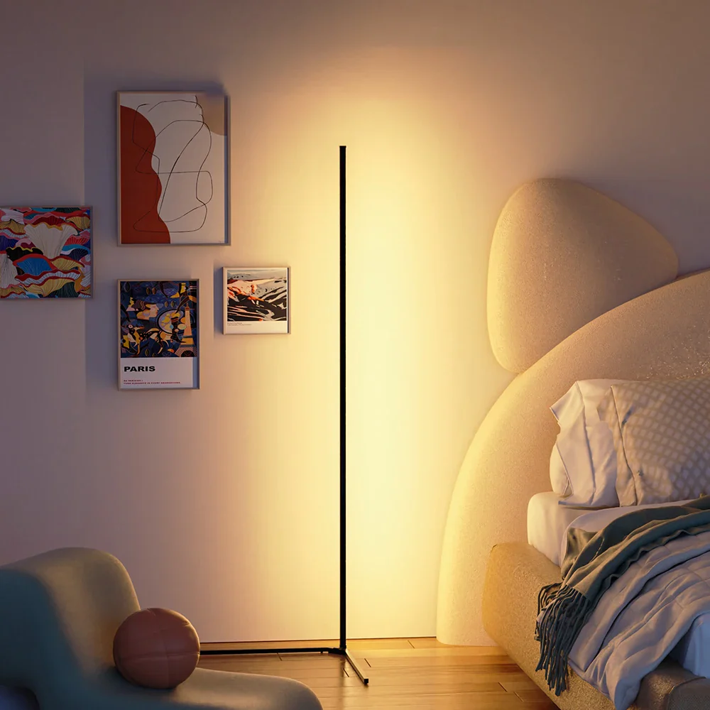 Modern living room with a floor lamp, sofa, and wall art